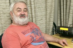 image of Dave Dixon sat in his shack ready to operate, sadly now deceased and a silent key